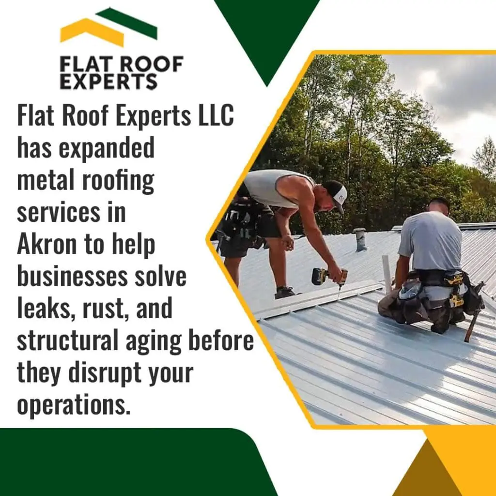Roofing contractors installing metal roofing panels on a commercial building in Akron, Ohio